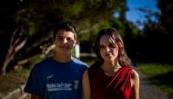Sofia Oliveira, a 18-year-old citizen from the suburbs of Lisbon and her brother Andre, 15-year-old, two of six young people taking 32 countries to the European Court of Human Rights for their inaction on climate, pose for a photograph in Almada on August 10, 2023. (Photo by Carlos Costa / AFP)