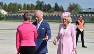 French PM Elisabeth Borne (L) greets Britain's King Charles III (C) and Britain's Queen Camilla (R) upon arrival at the Orly Airport on September 20, 2023. (Photo by Miguel Medina / POOL / AFP)