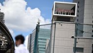 (Files) The logo of Japanese industrial group Toshiba is seen on top of a building at its headquarters in Tokyo on August 7, 2023. (Photo by Philip Fong / AFP)
 