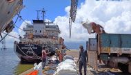 Labourers unload rice bags from a supply truck at India's main rice port at Kakinada Anchorage in the southern state of Andhra Pradesh, India. (Reuters file photo)
