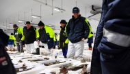 Buyers and workers attend Peterhead Fish Market, on the north east coast of Scotland, on September 7, 2023. (Photo by Andy Buchanan / AFP)