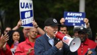 US President Joe Biden addresses striking members of the United Auto Workers (UAW) union at a picket line outside a General Motors Service Parts Operations plant in Belleville, Michigan, on September 26, 2023. (Photo by Jim Watson / AFP)