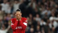 Liverpool's Dutch defender #04 Virgil van Dijk reacts at the end of the English Premier League football match between Tottenham Hotspur and Liverpool at Tottenham Hotspur Stadium in London, on September 30, 2023. Tottenham Hotspur wins 2 - 1 against Liverpool. (Photo by HENRY NICHOLLS / AFP)