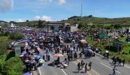 Indigenous people block a road during a protest demanding the resignation of Attorney General Consuelo Porras and prosecutor Rafael Curruchiche in San Cristobal Totonicapan, Guatemala, on October 2, 2023. (Photo by Gustavo RODAS / AFP)
