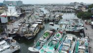 Fishing boats are moored at Tunggang fishing harbour ahead of the arrival of Typhoon Koinu in Pingtung county on October 4, 2023. Photo by Johnson LIU / AFP