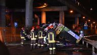 Firefighters work on the site of a bus accident on October 03, 2023 in Mestre, near Venice. (Photo by Marco Sabadin / AFP)

