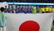 Japan's players sing the national anthem prior to the women's football gold medal match between Japan and North Korea during the 2022 Asian Games in Hangzhou in China's eastern Zhejiang province on October 6, 2023. (Photo by JUNG YEON-JE / AFP)