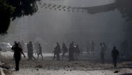 Palestinians evacuate a neighbourhood in Gaza City during Israeli airstrikes on October 11, 2023, as raging battles between Israel and the Hamas movement continued for the fifth consecutive day. Photo by MOHAMMED ABED / AFP