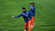 Netherlands’ Vikramjit Singh (L) and Shariz Ahmad attend a practice session on the eve of their 2023 ICC Men's Cricket World Cup one-day international (ODI) match against South Africa at the Himachal Pradesh Cricket Association Stadium in Dharamsala on October 16, 2023. (Photo by Money SHARMA / AFP