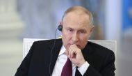 This pool photograph distributed by Russian state owned agency Sputnik shows Russia's President Vladimir Putin giving an interview at the Kremlin in Moscow on October 16, 2023. (Photo by Sergei Bobylyov / POOL / AFP)