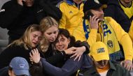 Swedish supporters react as they wait in the stand during the Euro 2024 qualifying football match between Belgium and Sweden at the King Baudouin Stadium in Brussels on October 16, 2023, after an 'attack' that targeted Swedish citizens in a street of Brussels. (Photo by John Thys / AFP)