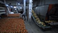 A bakery prepares rations of bread to pass out to internally displaced Palestinians in the Rafah refugee camp, in the southern Gaza Strip on October 17, 2023. (Photo by Mohammed Abed / AFP)
 