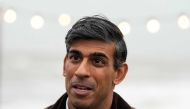 Britain's Prime Minister Rishi Sunak speaks to a TV reporter during a visit to Clacton-on-Sea, south east England, on October 18, 2023. (Photo by Frank Augstein / POOL / AFP)