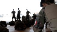 (FILES) French soldiers of the 2e Regiment Etranger de Parachutistes (2eREP - 2nd Foreign Parachute Regiment ) prepare for a mission on the French BAP air base, in Niamey, on May 14, 2023. (Photo by ALAIN JOCARD / AFP)
