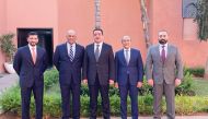 Officials pose for a group photo during the meeting in Marrakesh.