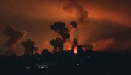 This image grab from an AFP TV footage shows fire and smoke rising above Gaza City during an Israeli strike on October 27, 2023, as battles between Israel and the Palestinian Hamas movement continue. (Photo by AFP)
