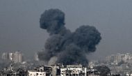 Smoke raising during an Israeli air strike in the northern Gaza Strip. (Photo by Aris MESSINIS / AFP)