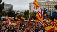 Protestors wave Spanish national flags as they take part in a demonstration called by the Spanish far-right Vox party against plans to grant amnesty to Catalan separatists, in Madrid on October 29, 2023. (Photo by Oscar Del Pozo / AFP)
