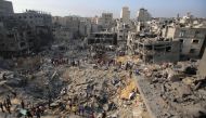Palestinians check the destruction in the aftermath of an Israeli strike in the Jabalia camp for Palestinian refugees in the Gaza Strip, on November 1, 2023. (Photo by Bashar Taleb / AFP)
