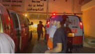 This image grab taken from an AFPTV video footage shows Palestinian medics at the Osama bin Zaid school, which shelters displaced people in the Saftawi area, north of Gaza City after a strike on November 3, 2023. (Photo by various sources / AFP)
