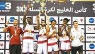 The players and officials of Qatar Team B celebrate after winning the GCC 3×3 Basketball Championship.