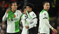 Liverpool's Colombian midfielder #07 Luis Diaz (2R) celebrates after scoring the equalising goal during the English Premier League football match between Luton Town and Liverpool at Kenilworth Road in Luton, north of London on November 5, 2023. (Photo by JUSTIN TALLIS / AFP) 