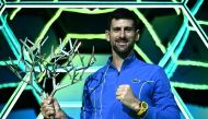 Serbia's Novak Djokovic poses with the trophy after winning the men's singles final match of the Paris ATP Masters 1000 tennis tournament against Bulgaria's Grigor Dimitrov, at the Accor Arena - Palais Omnisports de Paris-Bercy - in Paris on November 5, 2023. (Photo by Julien De Rosa / AFP)