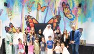 Commercial Bank officials with Qatari minors during the launch of the event.