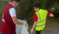 Youngsters participate in a cleanup activity organised by Al Rayyan Club to mark Qatar Sustainability Week.