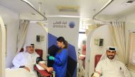 Ahlibank officials donating blood during the campaign, which was organised in cooperation with Hamad Medical Corporation.  