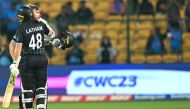 New Zealand's Tom Latham (L) and Glenn Phillips celebrate their win at the end of the 2023 ICC Men's Cricket World Cup one-day international (ODI) match against Sri Lanka at the M. Chinnaswamy Stadium in Bengaluru on November 9, 2023. (Photo by R.Satish BABU / AFP) 
