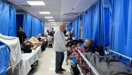 Patients and internally displaced people are pictured at Al-Shifa hospital in Gaza City on November 10, 2023. Photo by AFP