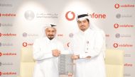 Vodafone Qatar Chief Executive Officer Sheikh Hamad Abdulla Jassim Al Thani and QFC Chief Executive Officer Yousuf Mohamed Al Jaida during the agreement signing.
