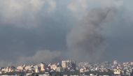 Smoke billowing over the Gaza Strip on November 16, 2023. (Photo by JACK GUEZ / AFP)
