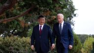 US President Joe Biden (right) and Chinese President Xi Jinping walk together after a meeting during the Asia-Pacific Economic Cooperation (APEC) Leaders' week in Woodside, California on November 15, 2023. (Photo by Brendan Smialowski / AFP)