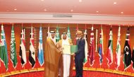 Prof Dr. Khalid bin Ibrahim Al Sulaiti, General Manager of Katara, receiving the certificate from ALESCO officials.