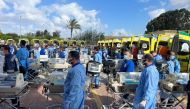 Egyptian medics stand by with incubators to receive premature Palestinian babies evacuated from Gaza on the Egyptian side of the Rafah border crossing with the Gaza Strip, on November 20, 2023. (Photo by AFP)