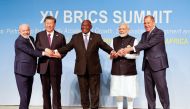 From left: President of Brazil Luiz Inacio Lula da Silva, President of China Xi Jinping, South African President Cyril Ramaphosa, Prime Minister of India Narendra Modi and Russia's Foreign Minister Sergei Lavrov during the 2023 BRICS Summit at the Sandton Convention Centre in Johannesburg, South Africa, on August 23, 2023. (Photo by Gianluigi Guercia / POOL / AFP)