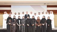 Officials pose for a group photo with participants of the Business of Banking Program.