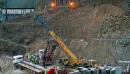 Rescue personnel work at the mouth of the collapsed under construction Silkyara tunnel in the Uttarkashi district of India's Uttarakhand state, on November 25, 2023. Photo by Arun SANKAR / AFP