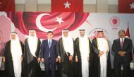 Minister of Sports and Youth H E Salah bin Ghanem bin Nasser Al Ali (second left); Minister of Awqaf and Islamic Affairs H E Ghanem bin Shaheen bin Ghanem Al Ghanim (first left); Minister of Justice H E Masoud bin Mohamed Al Ameri (centre); Minister of Environment and Climate Change H E Sheikh Dr. Faleh bin Nasser bin Ahmed bin Ali Al Thani (third right); Turkish Ambassador to Qatar H E Dr. Mustafa Goksu (third left); Ministry of Foreign Affairs Director of Protocol H E Ambassador Ibrahim Fakhro (second right) and Eritrean Ambassador and the Diplomatic Corps Dean H E Ali Ibrahim (first right) during the celebrations.