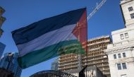 Demonstrators in support of Palestinians hold a rally to call for a ceasefire, at Dorchester Square in Montreal, Quebec, Canada, on November 18, 2023. (Photo by Alexis Aubin / AFP)