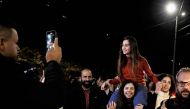 Newly released Palestinian prisoner Rouba Assi is carried by supporters during a welcome ceremony for prisoners freed from Israeli jails in exchange for Israeli hostages released by Hamas from the Gaza Strip, during a welcome ceremony in Ramallah in the occupied West Bank on November 28, 2023. (Photo by Kenzo Tribouillard / AFP)