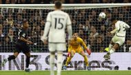Real Madrid's English midfielder #5 Jude Bellingham scores his team's second goal during the UEFA Champions League first round group C football match between Real Madrid CF and SSC Naples at the Santiago Bernabeu stadium in Madrid on November 29, 2023. (Photo by Oscar Del Pozo / AFP)