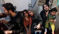 Family members mourn a baby girl killed in an Israeli strike in Rafah in the southern Gaza Strip, in the courtyard of the al-Najjar hospital on December 1, 2023. Photo by MOHAMMED ABED / AFP