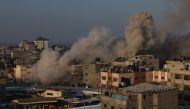 Smoke billows in Rafah following an Israeli air raid on the southern Gaza Strip city on December 1, 2023. (Photo by SAID KHATIB / AFP)