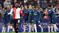 PSV's players celebrate their second goal during the Dutch Eredivisie football match between Feyenoord Rotterdam and PSV Eindhoven at Feyenoord Stadion de Kuip in Rotterdam on December 3, 2023. (Photo by Olaf Kraak / ANP / AFP) 
