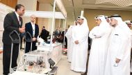Minister of Environment and Climate Change H E Sheikh Dr. Faleh bin Nasser bin Ahmed bin Ali Al Thani, President of QU Dr. Omar Al Ansari with other officials touring the exhibition.
