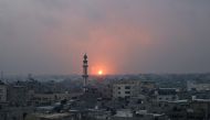 This picture taken on December 5, 2023 shows an explosion in Khan Yunis. (Photo by Mohammed ABED / AFP)