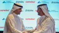 Ooredoo MD and Group CEO Aziz Aluthman Fakhroo and Zain Vice-Chairman & Group CEO Bader Al-Kharafi during the signing ceremony. 